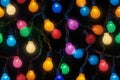 Vibrant Multicolored String Lights on Black Background Royalty Free Stock Photo