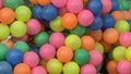 Close-up shot of vibrant multi-colored plastic balls in a net, creating a cheerful display Royalty Free Stock Photo