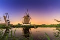 Vibrant night windmill Royalty Free Stock Photo