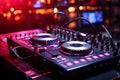 Vibrant nightlife: Pink DJ headphones, sound mixer, and turntables in the club. Royalty Free Stock Photo