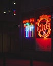 Vibrant nightlife scene featuring a club illuminated by a glowing red neon sign Royalty Free Stock Photo