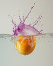 Vibrant Orange Fruit Splashing into Water with Purple Liquid Burst Royalty Free Stock Photo