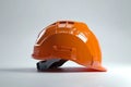 orange hard safety hat on white background, Generative AI