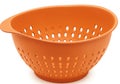 Orange plastic colander with handle and drainage holes Royalty Free Stock Photo