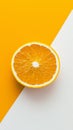 Vibrant orange slice sits on a split background of yellow and white, creating a visually appealing contrast with its juicy texture Royalty Free Stock Photo