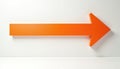 Vibrant orange three dimensional arrow points right on clean white wall. Clearly signifies direction, future path, next step Royalty Free Stock Photo
