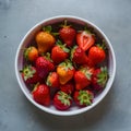 Vibrant Organic Strawberries White Dish on Muted Gray Background