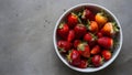 Vibrant Organic Strawberries White Dish on Muted Gray Background Royalty Free Stock Photo