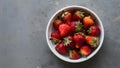 Vibrant Organic Strawberries White Dish on Muted Gray Background Royalty Free Stock Photo