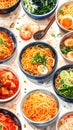 A vibrant overhead shot of various noodle dishes in blue bowls, showcasing a rich array of colors and textures on a light Royalty Free Stock Photo