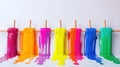 Colorful Melting Paint Drips From Wooden Stick, Creating a Bright Vibrant Display Royalty Free Stock Photo