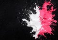 Vibrant paint splash on black background Royalty Free Stock Photo
