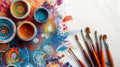 Vibrant paint splashes with colorful bowls and brushes, embodying creativity and the art process
