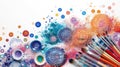 Vibrant paint splatters and dots with brushes on white, a burst of creative energy
