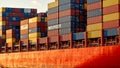 Vibrant painted container ship hull with colorful cargo containers casting long shadows Royalty Free Stock Photo