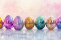 Vibrant Painted Easter Eggs Row. A row of vividly painted Easter eggs against a soft pink background Royalty Free Stock Photo