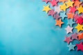 vibrant paper stars and colorful confetti, arranged on a solid color background, creating a joyful and cheerful atmosphere. Royalty Free Stock Photo