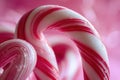 A vibrant photo showcasing two candy canes up close against a pink background, A close-up of a candy cane, AI Generated