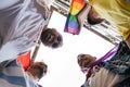 Joyful Circle: Four Gay Friends Embrace Diversity with Pride Accessories Royalty Free Stock Photo