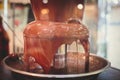 Vibrant Picture of Chocolate Fountain Fontain on childen kids birthday party with a kids playing around and marshmallows and fruit Royalty Free Stock Photo