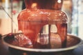 Vibrant Picture of Chocolate Fountain Fontain on childen kids birthday party with a kids playing around and marshmallows and fruit