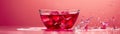 Vibrant Pink Beverage Splashing from a Modern Glass Bowl on a Reflective Surface with a Pink Background Royalty Free Stock Photo