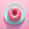 Vibrant pink donut adorned with delicate white sprinkles. Royalty Free Stock Photo