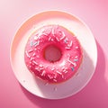 Vibrant pink donut adorned with delicate white sprinkles. Royalty Free Stock Photo