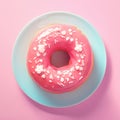 Vibrant pink donut adorned with delicate white sprinkles. Royalty Free Stock Photo