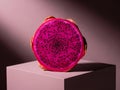 Vibrant Pink Dragon Fruit Half on Modern Geometric Cube Royalty Free Stock Photo