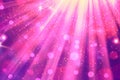 Vibrant Pink and Purple Light Rays Emanating With Sparkles and Bokeh Royalty Free Stock Photo