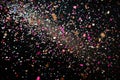 A vibrant and plentiful amount of confetti spreads across a black background, creating a festive and energetic atmosphere, A burst