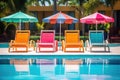 vibrant poolside lounge chairs with pool umbrellas Royalty Free Stock Photo