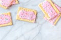 Vibrant pop tarts, shot from above on a marble background Royalty Free Stock Photo