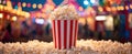 The vibrant popcorn bucket surrounded by a sugary carnival atmosphere..AI generated image Royalty Free Stock Photo