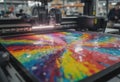 Vibrant printing process showcasing colorful artwork on a large printer Royalty Free Stock Photo