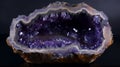 Vibrant purple amethyst geode rock, sparkling and lustrous crystals inside with striking textures and natural patterns