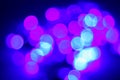 Vibrant purple and blue color illumination bokeh. Dark background. Holiday backdrop. Night lights Royalty Free Stock Photo