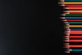 Vibrant Rainbow Colored Pencils Stacked Against a Dark Background for Creative Projects Royalty Free Stock Photo