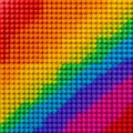 Vibrant rainbow colors formed by densely packed interlocking plastic construction blocks creating a perfect seamless texture Royalty Free Stock Photo