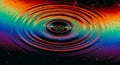 Vibrant rainbow ripples emanating from a central point on a dark background Royalty Free Stock Photo