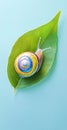 Vibrant Rainbow Snail Shell on Green Leaf with Light Blue Background Minimalist Nature Concept Royalty Free Stock Photo