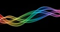 Vibrant Rainbow Swirls of Light Flowing in Intersecting Waves Against a Deep Black Background Royalty Free Stock Photo