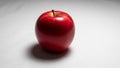 A vibrant red apple is centered against a plain white background Royalty Free Stock Photo