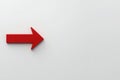 Bright red downward arrow on a smooth, clean, solid background indicating a decline or decrease