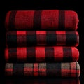 The vibrant red and black plaid pattern of this cozy folded bedding set makes it perfect for adding warmth and style to Royalty Free Stock Photo