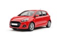 A vibrant red compact hatchback car with modern styling presented isolated on white background Royalty Free Stock Photo