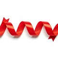 A vibrant red decorative ribbon with elegant wavy ends and bow Royalty Free Stock Photo