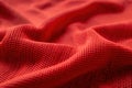 Vibrant red fabric with grid-like pattern. Synthetic material is durable and wrinkle-resistant. Unique texture adds depth. Royalty Free Stock Photo