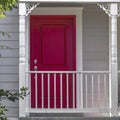 Vibrant red front door and balcony of a home Royalty Free Stock Photo